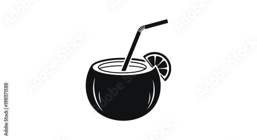 A black coconut cocktail with a straw and lime wedge