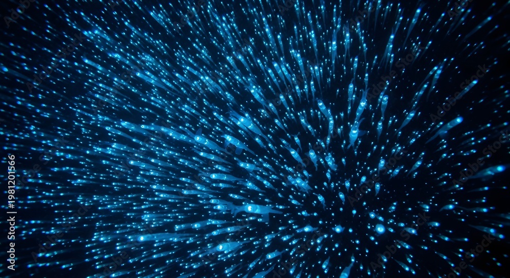 Fototapeta premium Abstract glowing blue particles exploding outwards in darkness with bokeh effect