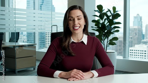 Professional Woman Smiling at Camera in Modern Office with City View