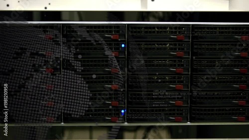 Server rack showing faint left reflection, tech leaning and checking drives for status LED blinking