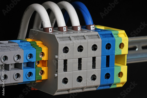 Electrical screw terminals for connecting copper electrical wires with metal lugs in electrical switchboard. 