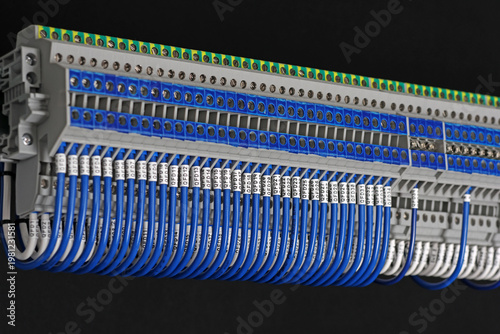 Electrical screw terminals for connecting copper electrical wires with metal lugs in electrical switchboard. 