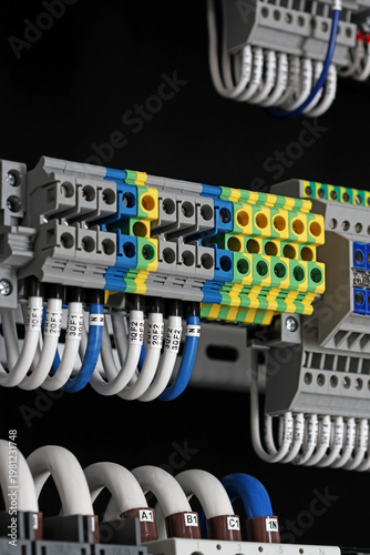Electrical screw terminals for connecting copper electrical wires with metal lugs in electrical switchboard. 