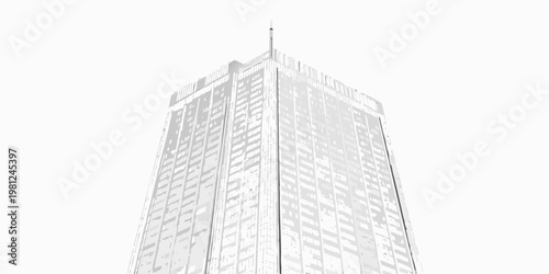 Low angle view of a tall modern building with a pointed spire