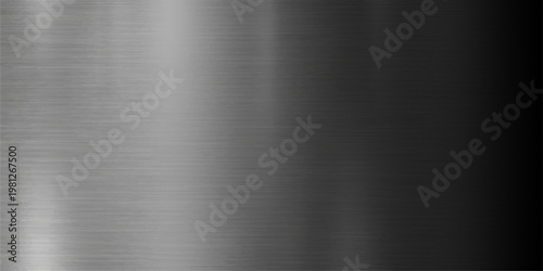 A polished stainless steel plate creates a brushed metal texture background with a shiny silver metallic surface and industrial gray pattern