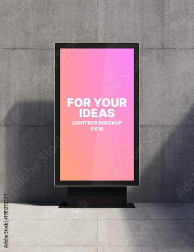 A 9x16 vertical lightbox stands on a metal support against a concrete wall for presenting your ideas. Presentation space. Advertising space. 3D rendering