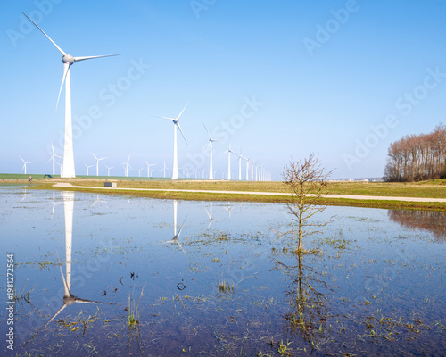 Wind turbines reflected in water Urk Netherlands