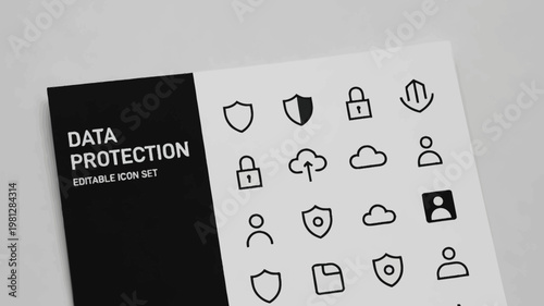 Data protection icons are printed on a white sheet of paper featuring a bold black and white design.
