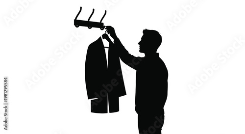 Man hanging a jacket on a rack in a silhouette style