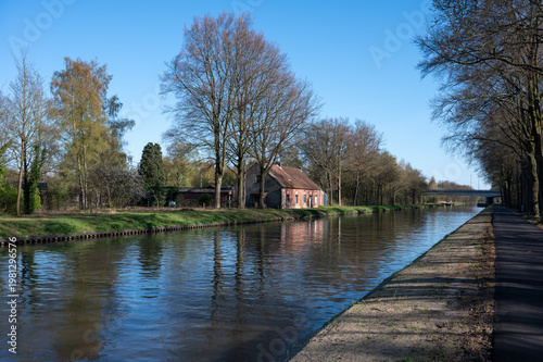 Brick houses reflected in canal water