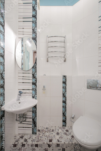 Sink and toilet bowl in the bathroom