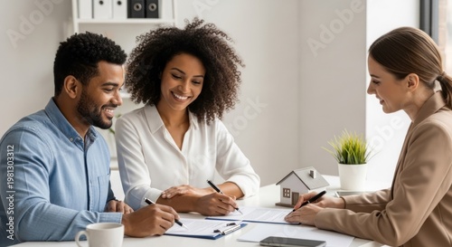 Diverse couple signs contract with real estate agent in modern office.