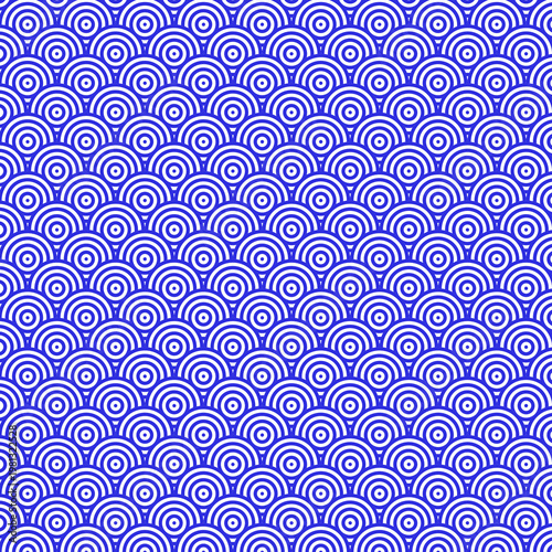 Seamless blue and white concentric circle pattern, reminiscent of Japanese Seigaiha waves, creating a calming, repetitive, and abstract background.