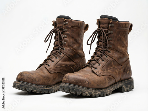 A pair of soldier boots displayed on a white background, showcasing their rugged design and sturdy construction.
