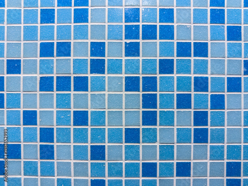 Wallpaper Mural Horizontal view of a vibrant blue mosaic tile pattern featuring a random mix of light and dark azure squares with white grout lines providing a clean geometric texture for modern interior design Torontodigital.ca