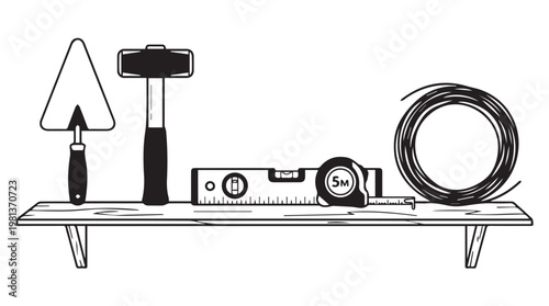 Set of essential masonry tools on wooden workbench with measuring tape and trowel