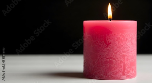 Pink Textured Pillar Candle Burning on White Table