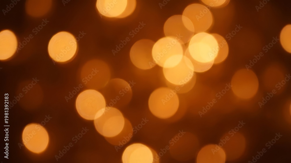 Fototapeta premium Warm Amber Bokeh Lights Abstract Festive Glow Background.
