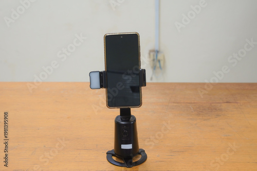 Smartphone on an automatic tracking stand for video recording