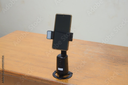 Smartphone on an automatic tracking stand for video recording