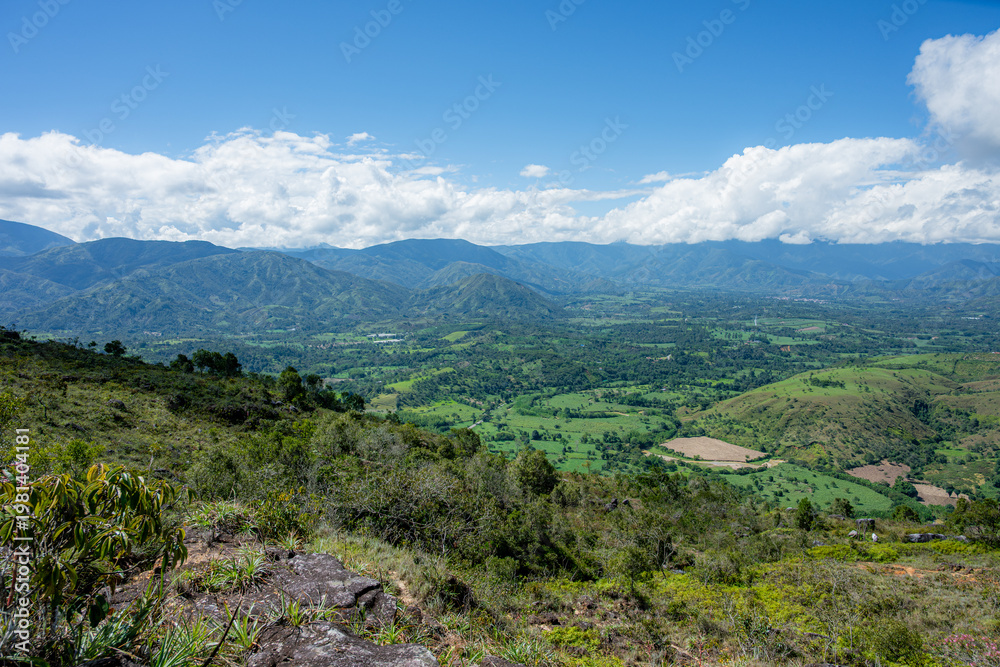 Fototapeta premium Mogotes valley landscape panorama with green mountains and blue sky