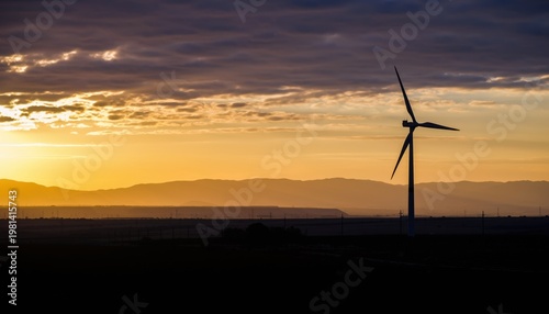 Wind Turbine at Sunset with Mountain Backdrop