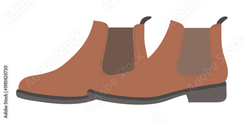 A pair of brown chelsea boots with dark gray soles are displayed