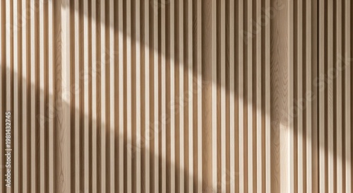 Precisely aligned vertical wood slats with soft light and shadow patterns creating a warm, natural texture for modern interior design.