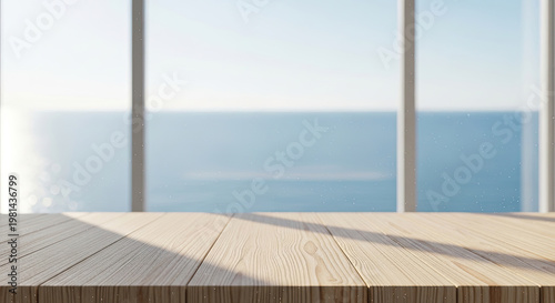 Sunny wooden table top with a view of the sea through a large window creating a serene coastal atmosphere and bright ambiance