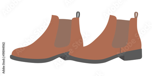 A pair of orange flat heeled chelsea boots against a black background