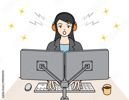 イヤーマフを装着してPC作業に集中する女性