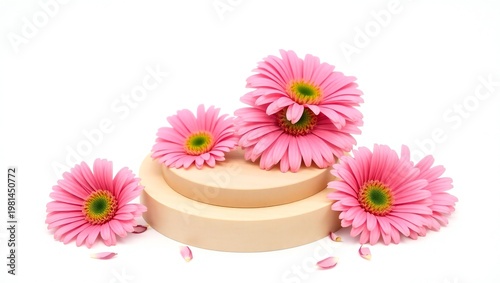 Delicate pink gerbera daisies arranged on a two tiered cake stand