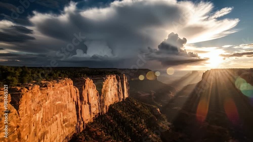 Dramatic Cumulonimbus Clouds Over Grand Canyon At Sunset With Sunbeams And Lens Flare