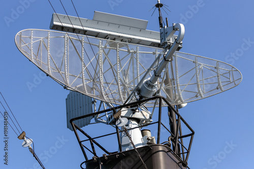 Radar transmit and beam from the mast of a warship during a mission to detect enemy ships.

