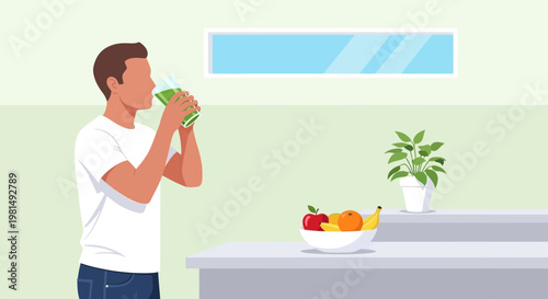 Man drinking green smoothie in kitchen with fruit bowl and plant