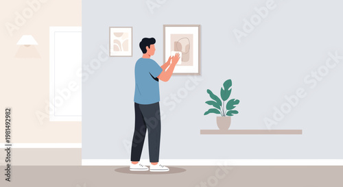 Man hanging artwork on wall, interior design, home decor, modern living room
