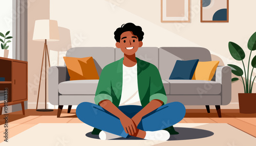 Young man smiles calmly on a cozy living room floor. Soft light bathes the space, creating warmth and comfort. Modern couch and plants add charm to the room. He sits cross-legged, relaxed and content