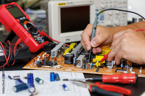 Electronics technician, electronic engineering electronic repair,electronics measuring and testing, repair and maintenance concepts.	