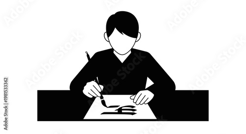 Man sitting at desk writing.