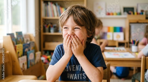 Child giggling with mouth covered