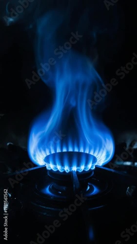 Wallpaper Mural Gas stove burner with blue flame and smoke in dark Torontodigital.ca