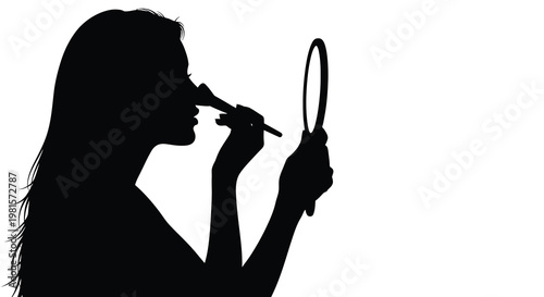 Silhouette of a woman applying makeup while looking in a handheld mirror