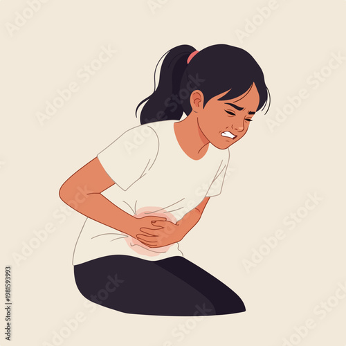 Young girl in white t-shirt kneeling and clutching her aching abdomen in pain