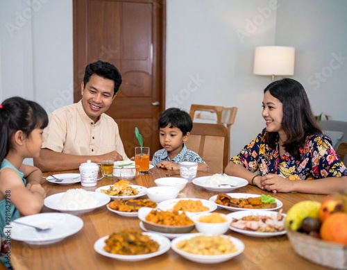 A warm and authentic moment of a Southeast Asian family enjoying a meal together at home. The image highlights family bonding, cultural lifestyle, and emotional connection in a natural setting.