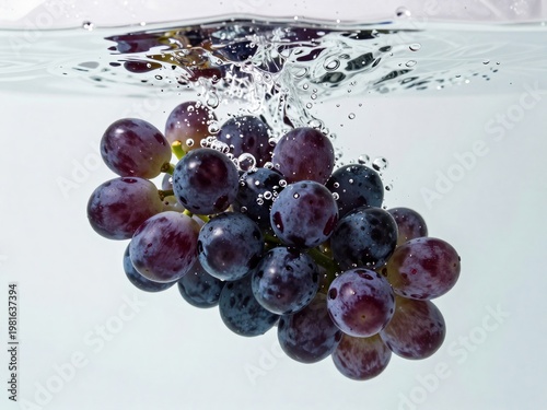 Red Grapes Splashing Under Water