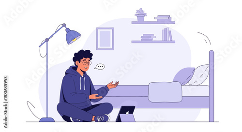 Young man in hoodie video calling on laptop in cozy bedroom with bed and lamp