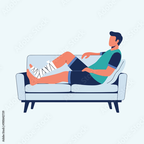 A man sitting on a sofa with his injured foot wrapped in a white medical bandage
