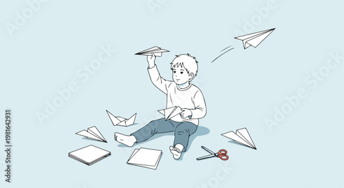 A young boy sitting on the floor and playing with handcrafted paper airplanes