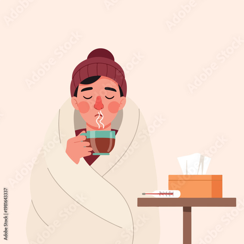 Sick person wrapped in a blanket drinking tea with a thermometer and tissues