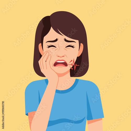 A young woman grimacing in pain while holding her cheek to indicate a toothache